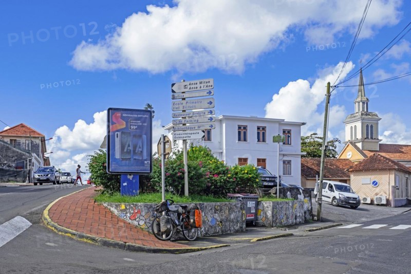 Streetscene at the village Morne-Vert showing church and French street signs on the island of Martinique in the Caribbean Sea