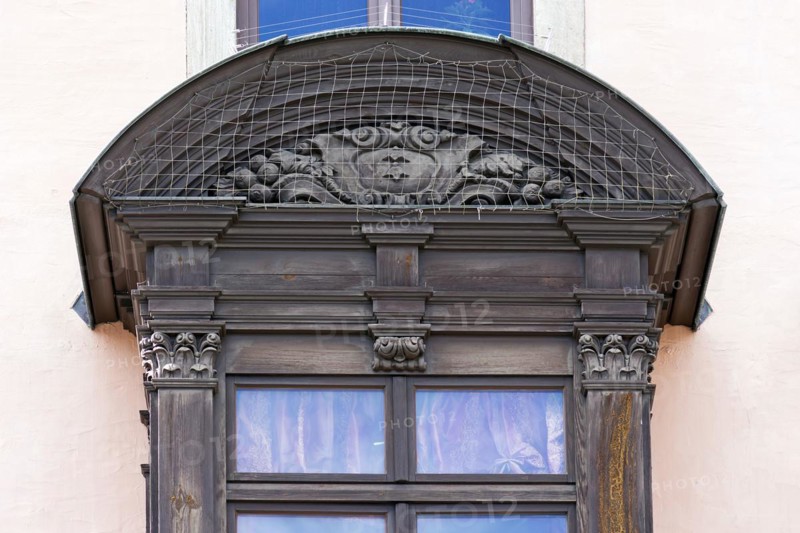 Detail of the historic oriel with pigeon grille