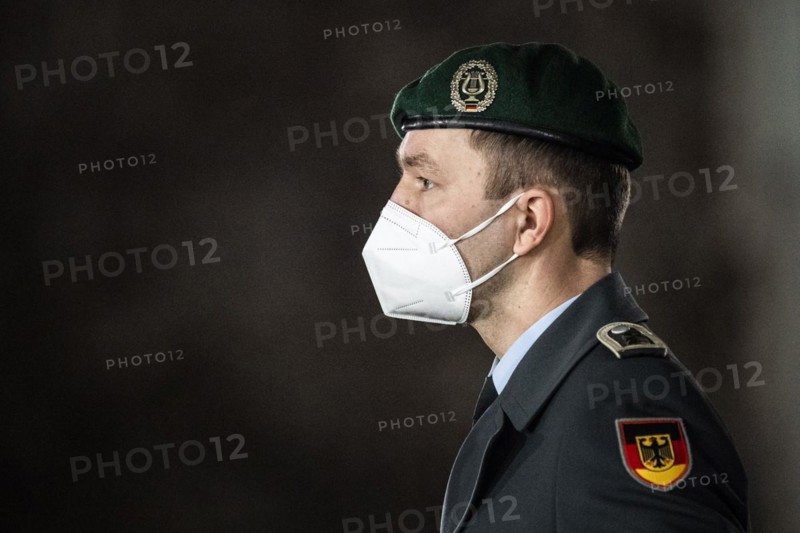 A soldier of the German Armed Forces wearing mouth-nose protection