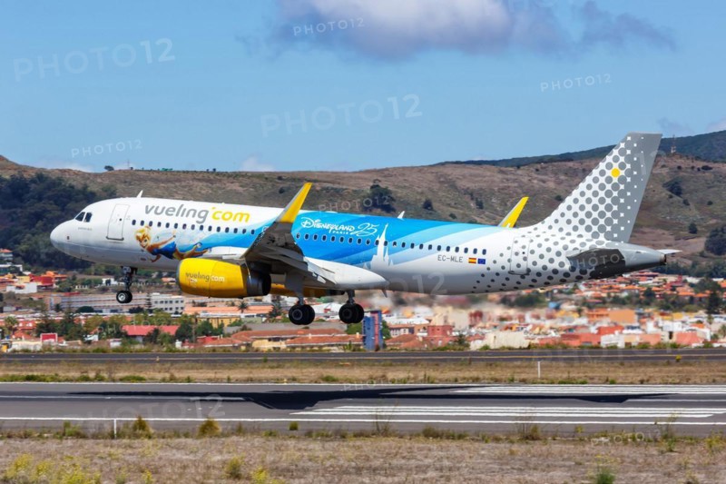 A Vueling Airbus A320 aircraft with registration EC-MLE and the 25 years Disneyland Paris special livery at Tenerife Airport