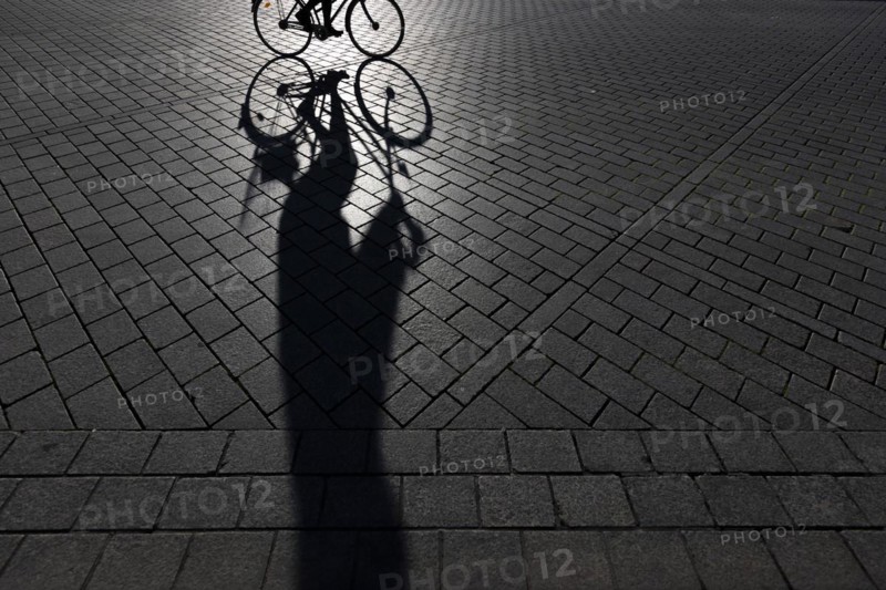 The silhouette of a cyclist stands out in Berlin