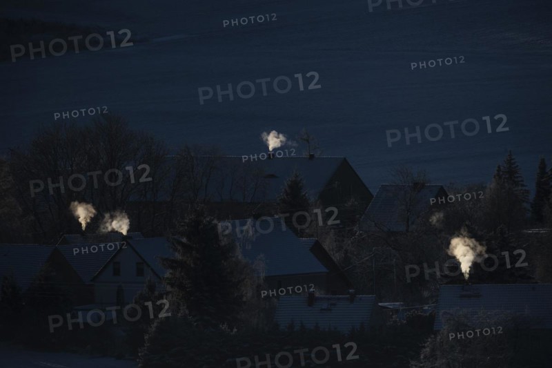 Smoke is visible from the chimneys on an icy morning in Koenigshain