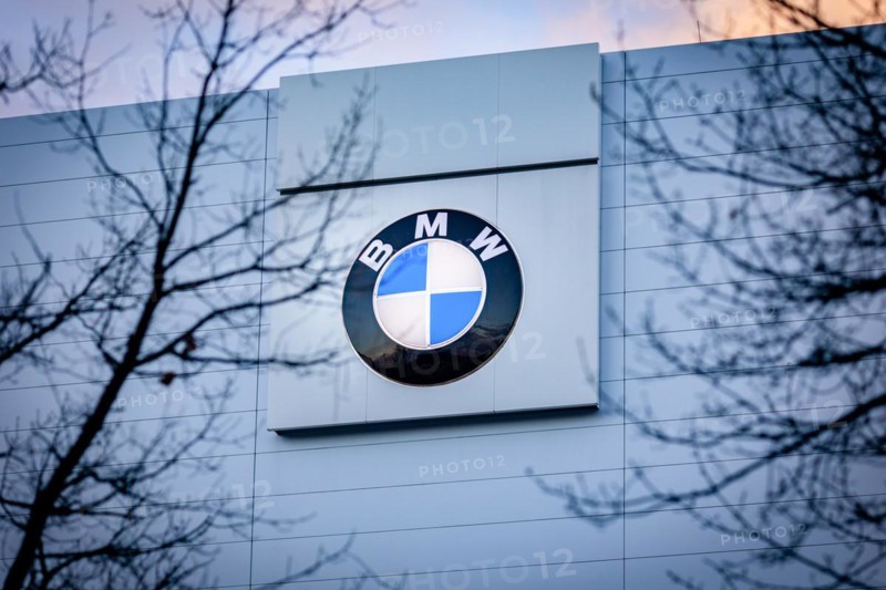 A sign of the car manufacturer BMW in front of a branch in Siemensstadt in Berlin