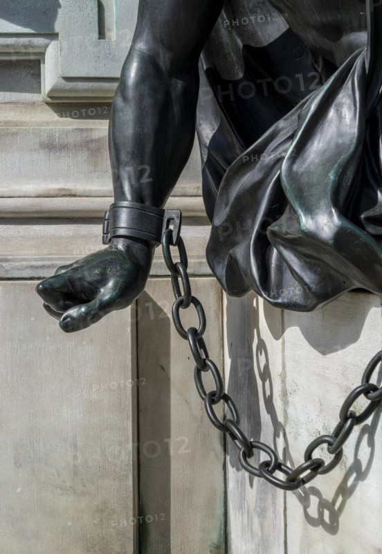 Detail photo of the chained warriors at the base of the equestrian statue of Frederick William of Brandenburg