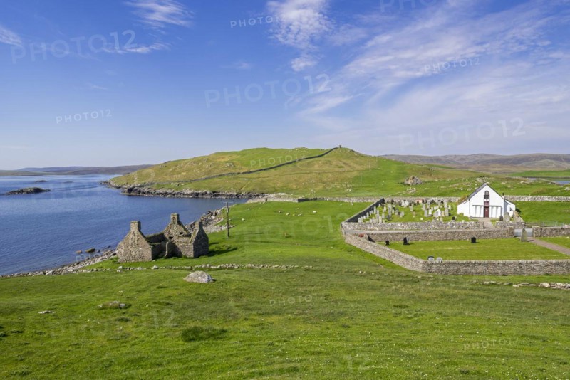 Ruin of old fishing booth and 18th century Lunna Kirk at East Lunna Voe