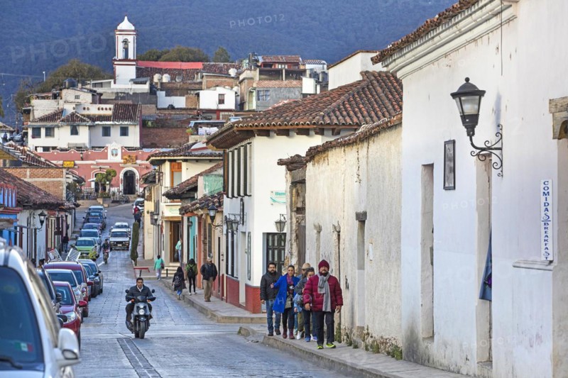 Tourists walking in street in the Mexican city San Cristobal de las Casas