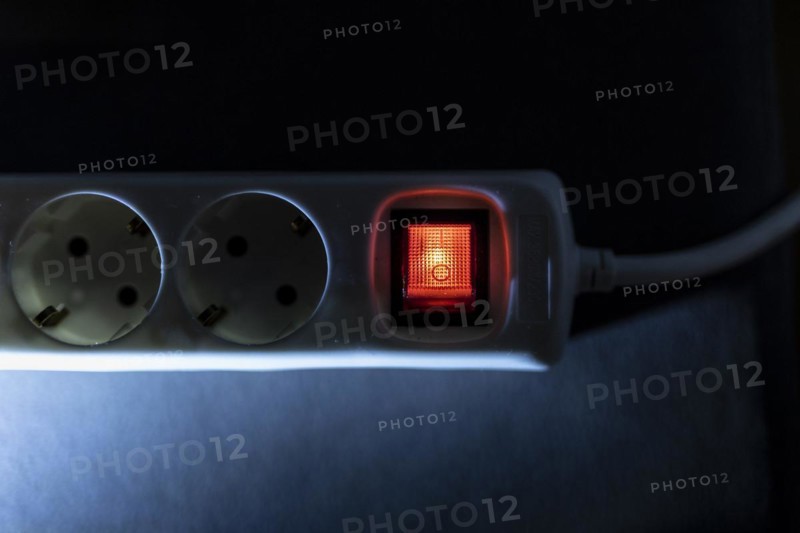 A distribution socket with a luminous switch