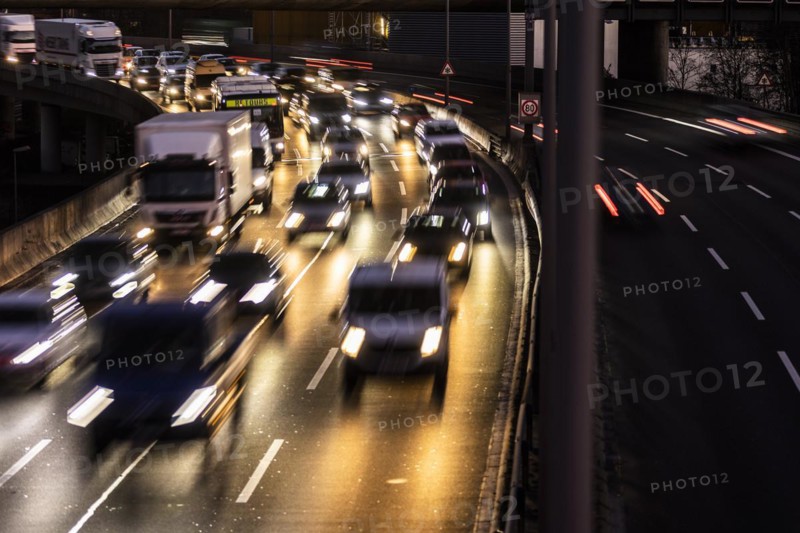 Congested traffic on the A100 looms at blue hour in Berlin