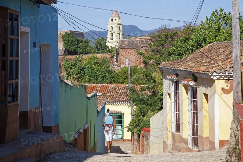 Pastel coloured houses with grilles and bell tower of the Iglesia y Convento de San Francisco