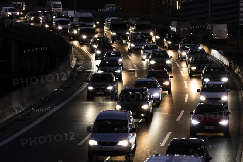 Congested traffic on the A100 looms at blue hour in Berlin