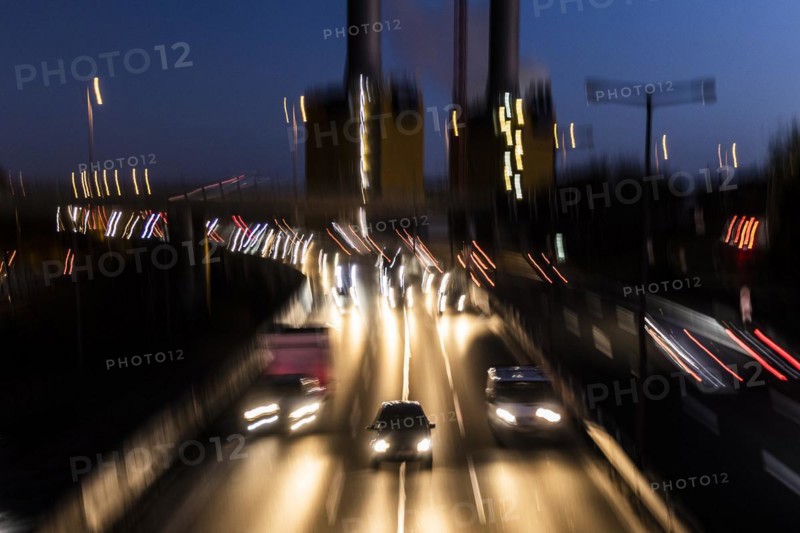 Traffic on the A100 looms at blue hour in Berlin