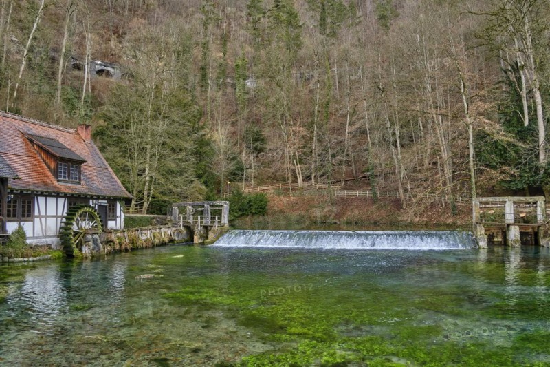 The Blautopf with historic hammer mill in Blaubeuren on the eastern edge of the Swabian Alb near Ulm