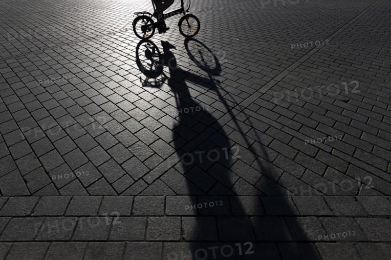 The silhouette of a cyclist stands out in Berlin