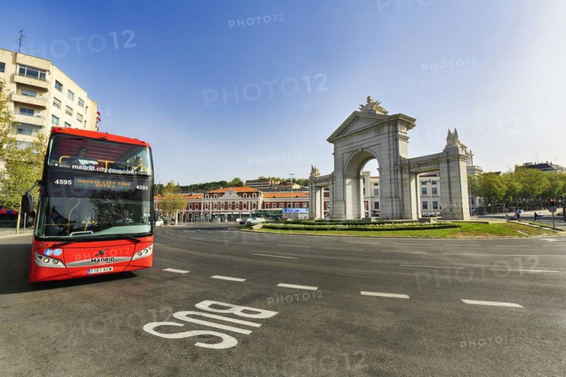 Monumental gate Puerta de San Vicente in a roundabout