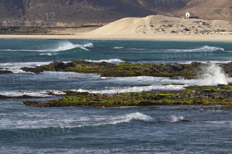 Praia de Fatima and abandoned chapel of Our Lady of Fatima looking over the rugged coast and cliffs near Sal Rei on the island Boa Vista