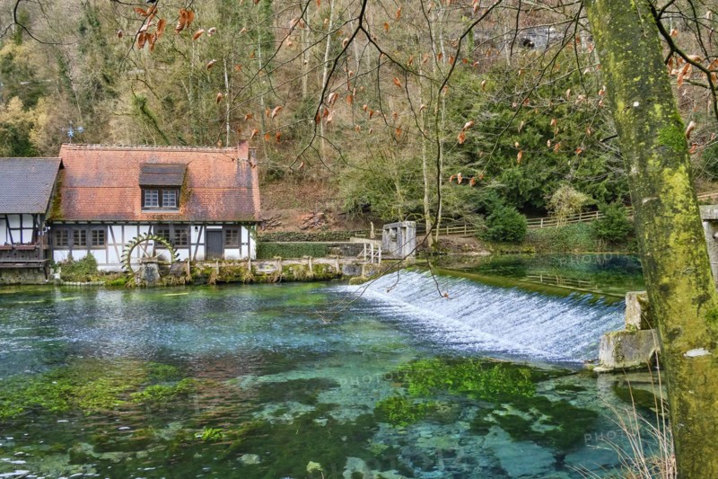 The Blautopf with historic hammer mill in Blaubeuren on the eastern edge of the Swabian Alb near Ulm
