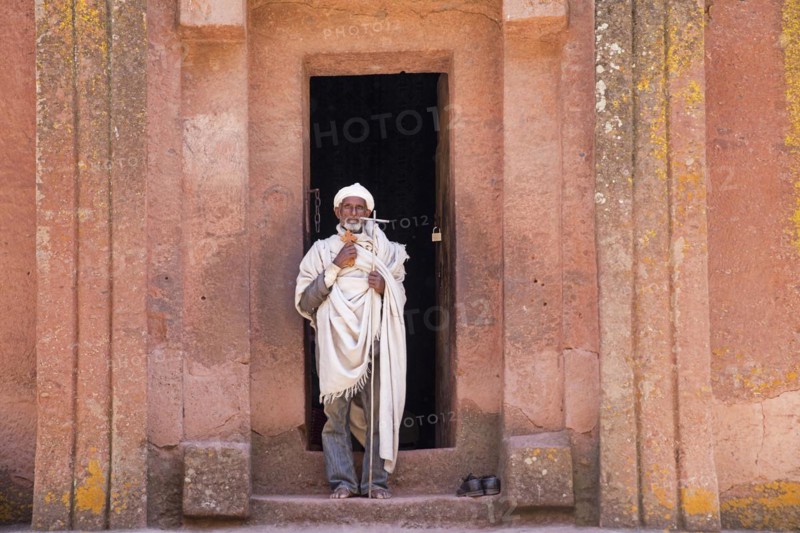 Priest leaving the Biete Gabriel-Rufael