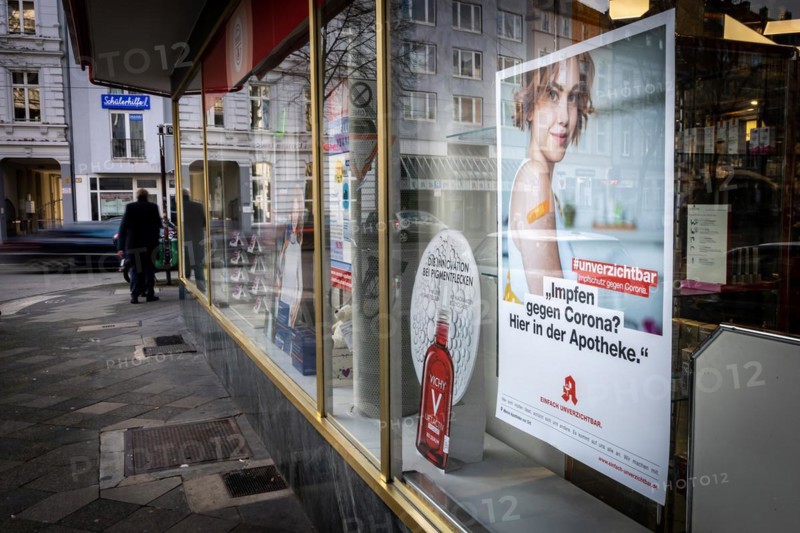 A poster in a pharmacy advertising the possibility to be vaccinated at pharmacies in Duesseldorf