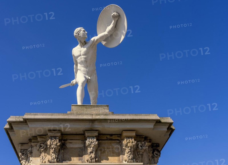 Statue of naked warriors in front of the main entrance to Charlottenburg Palace