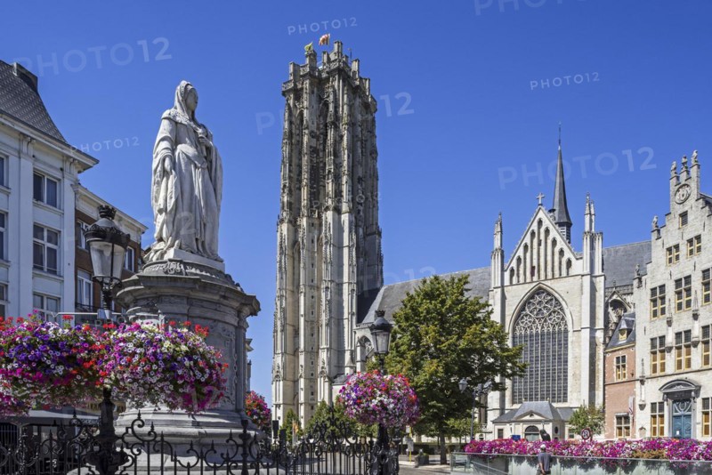 Statue of Archduchess Margaret of Austria and the St. Rumbold's Cathedral in the city Mechelen
