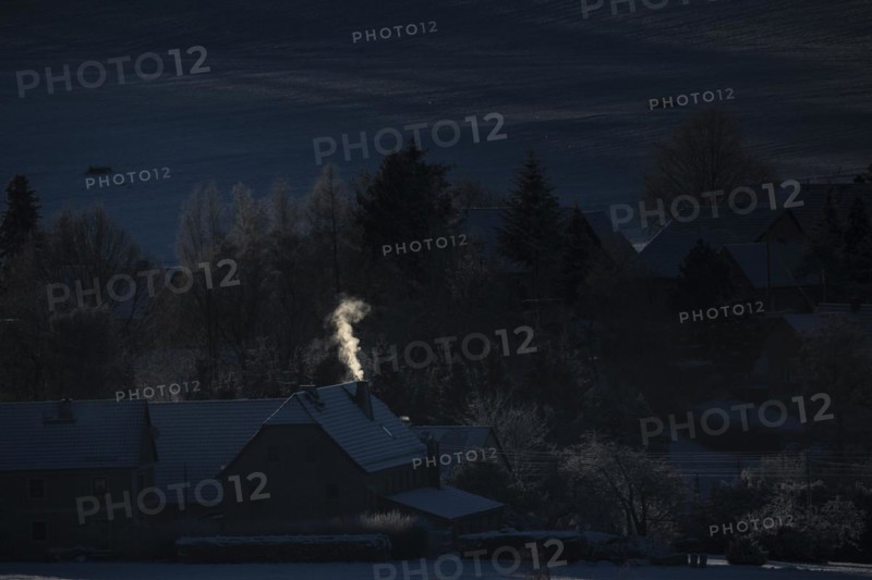 Smoke is visible from the chimneys on an icy morning in Koenigshain