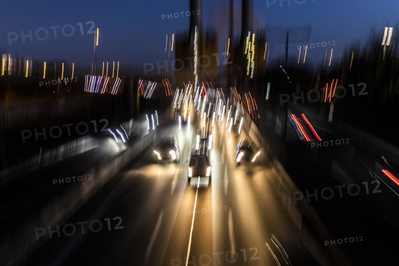 Traffic on the A100 looms at blue hour in Berlin