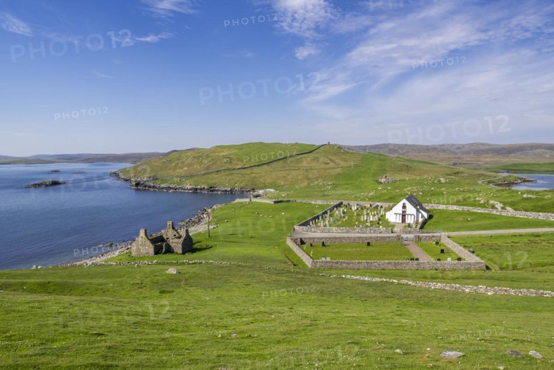 Ruin of old fishing booth and 18th century Lunna Kirk at East Lunna Voe