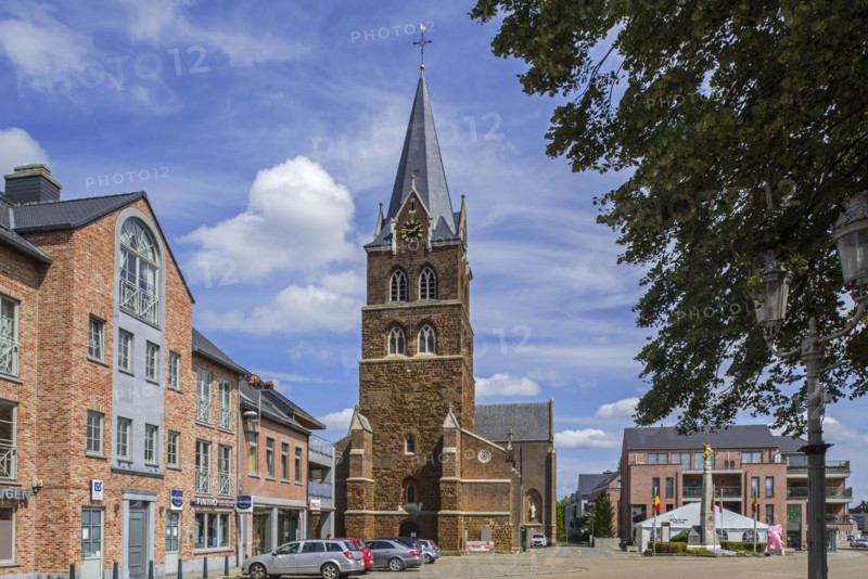 Church and gilded equestrian statue on market square remembering Battle of the Silver Helmets