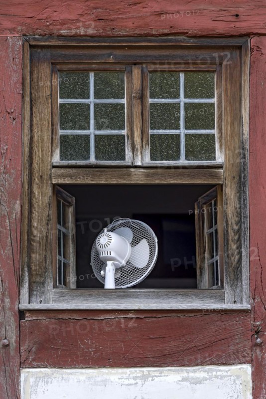 Window with fan to cool the room in hot weather