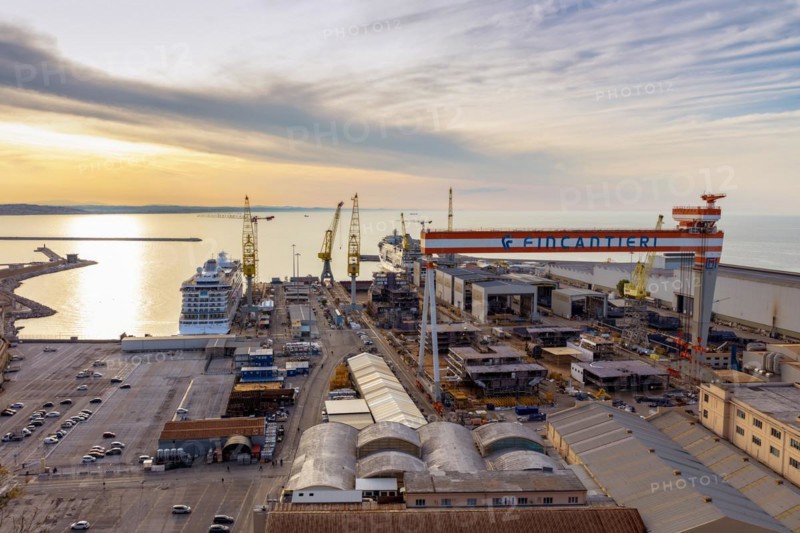 The Fincantieri shipyard in the industrial harbour at dusk