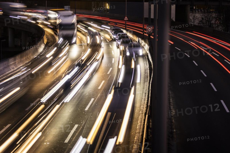 Congested traffic on the A100 looms at blue hour in Berlin