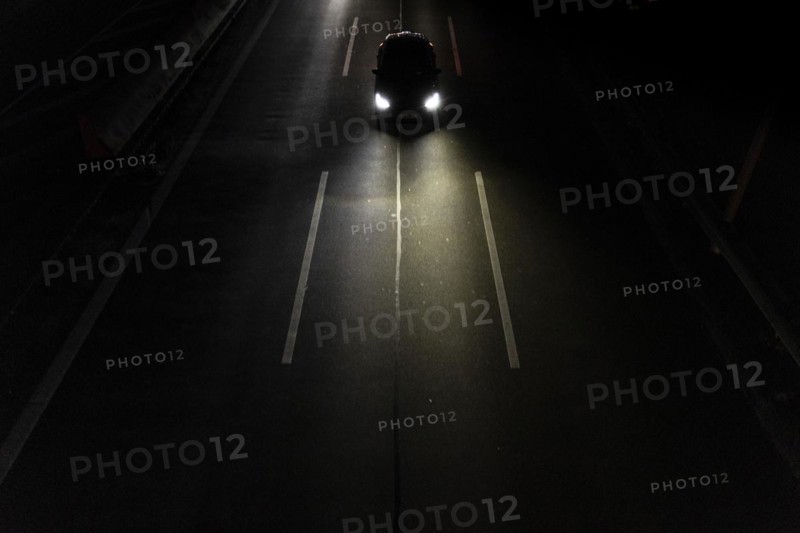 A car on the A100 stands out at blue hour in Berlin