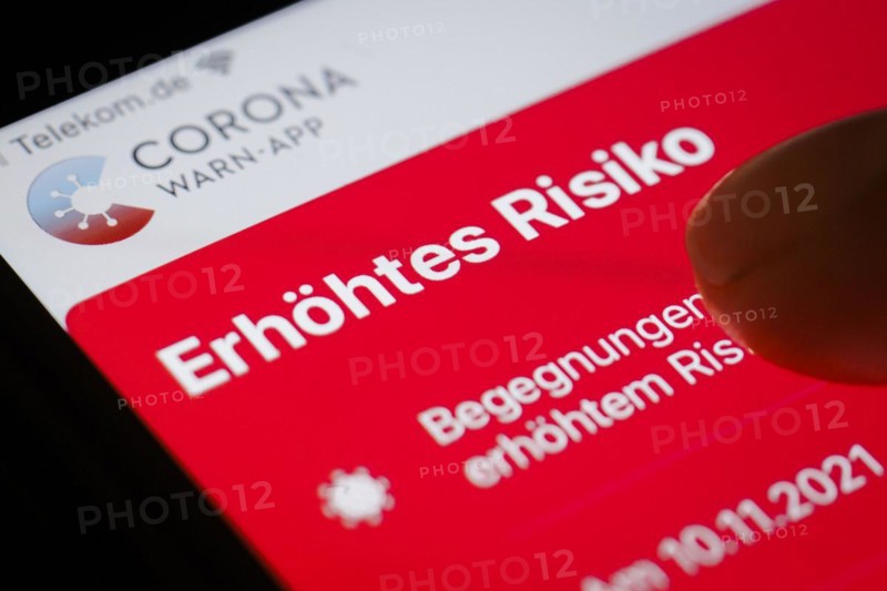 The Corona Warn app displays the words Increased Risk on a smartphone. Berlin