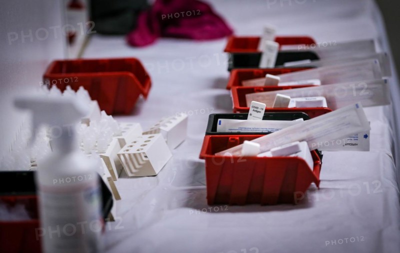 Rapid tests with stopwatches are ready in trays for use in a COVID-19 vaccination and testing centre at Autohaus Olsen in Iserlohn
