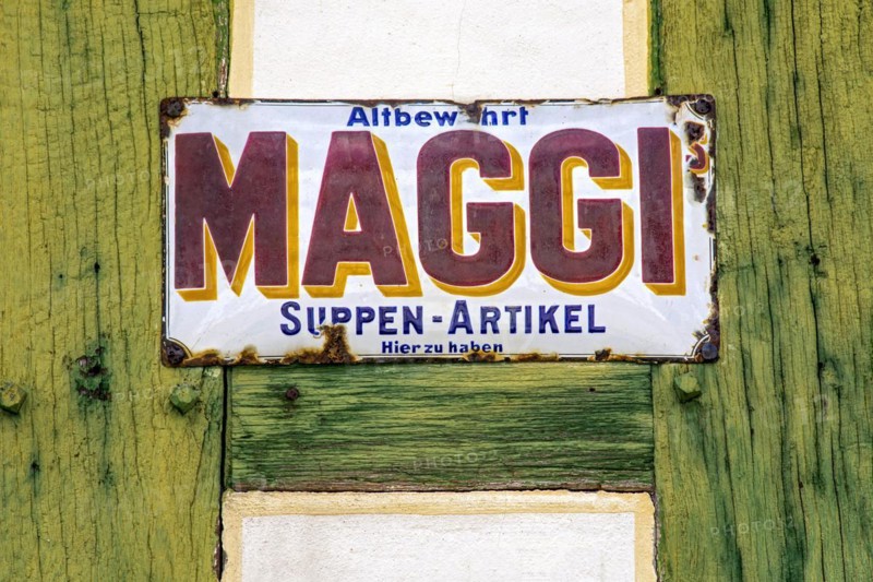 Rusty historical enamel sign