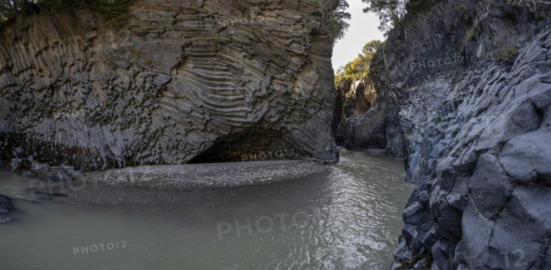 Rock formations of basalt and lava rock in the river park Gole dell' Alcantara