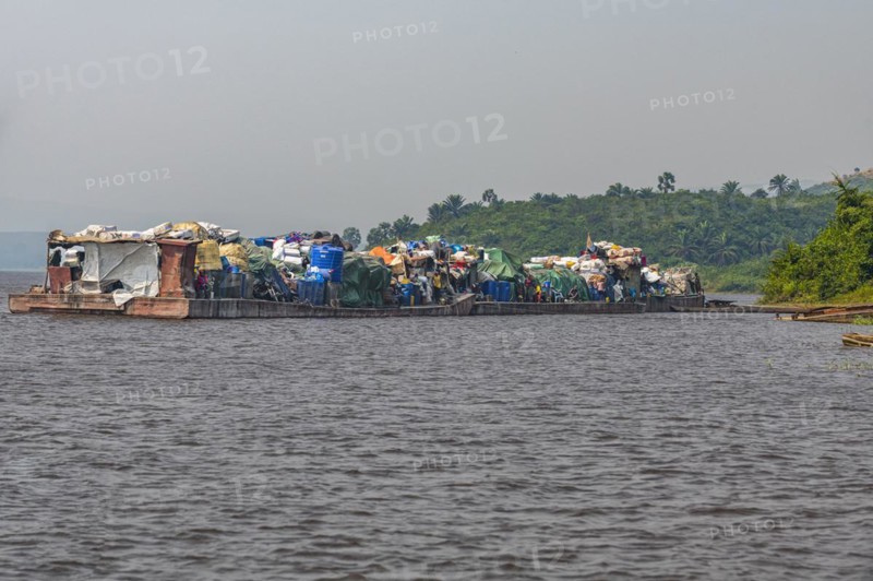 Overloaded riverboat on the Congo river