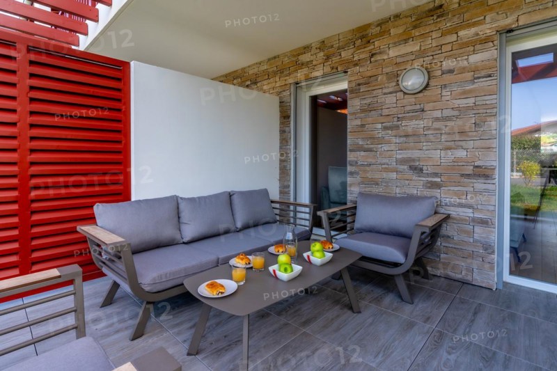 Summer house terrace. Beautiful terrace with breakfast prepared at dawn next to the garden