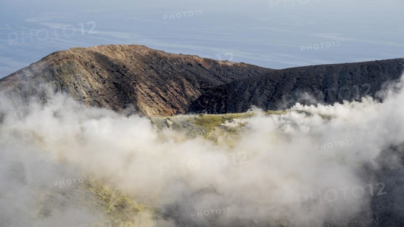Smoking sulphur fumaroles at the crater rim