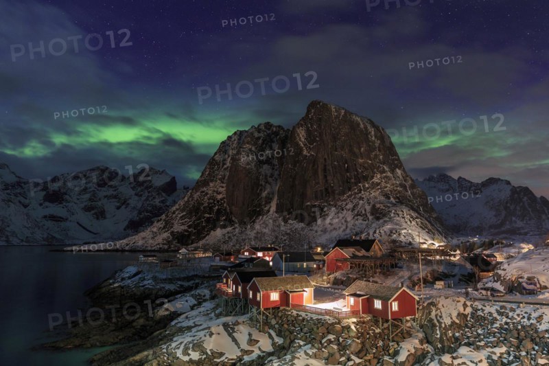 Northern Lights or Aurora Borealis over red rorbuer