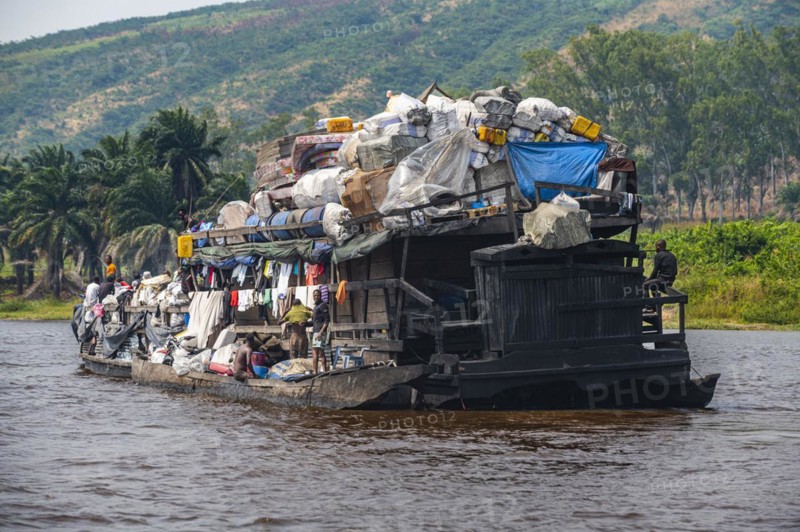 Overloaded riverboat on the Congo river