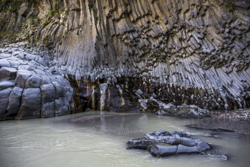 Rock formations of basalt and lava rock in the river park Gole dell' Alcantara