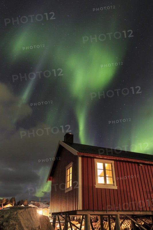 Northern Lights or Aurora Borealis over red rorbuer