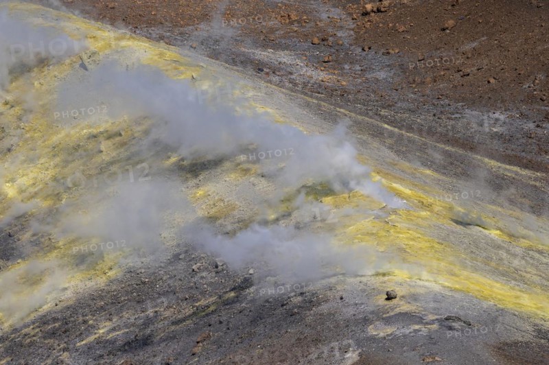 Smoking sulphur fumaroles at the crater rim