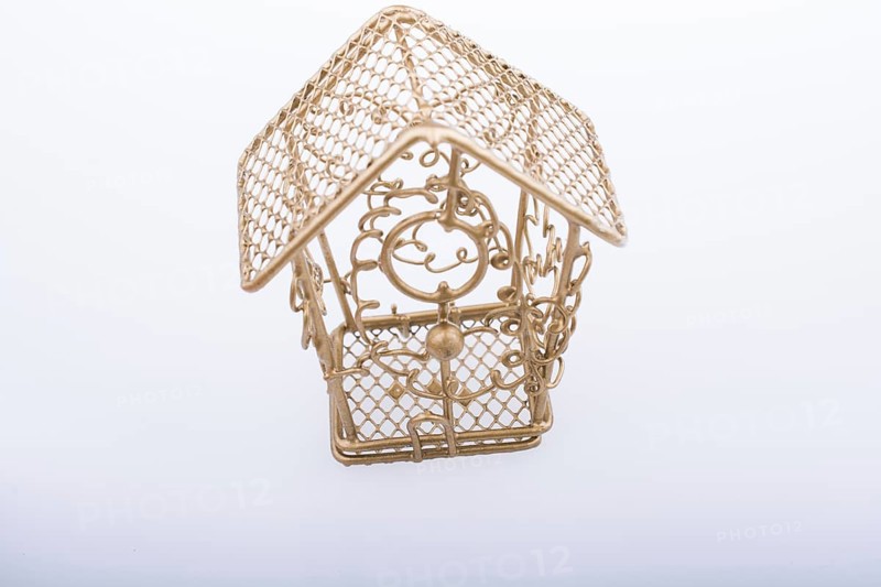 Little white bird house made of metal