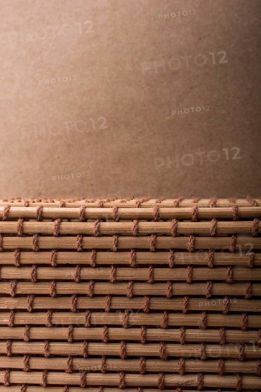 Straw mat and brown background for background usage