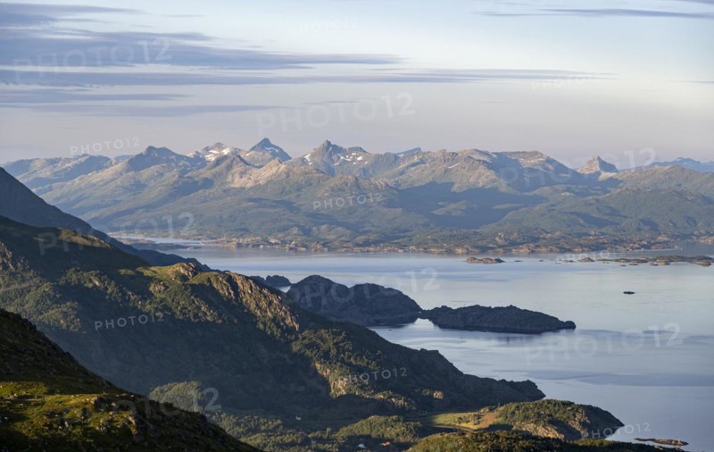 View of fjord and mountains in the evening light
