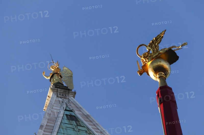 Campanile with the gilded Archangel Gabriel and flagpole with St Mark's lions on the Piiazza San Marco