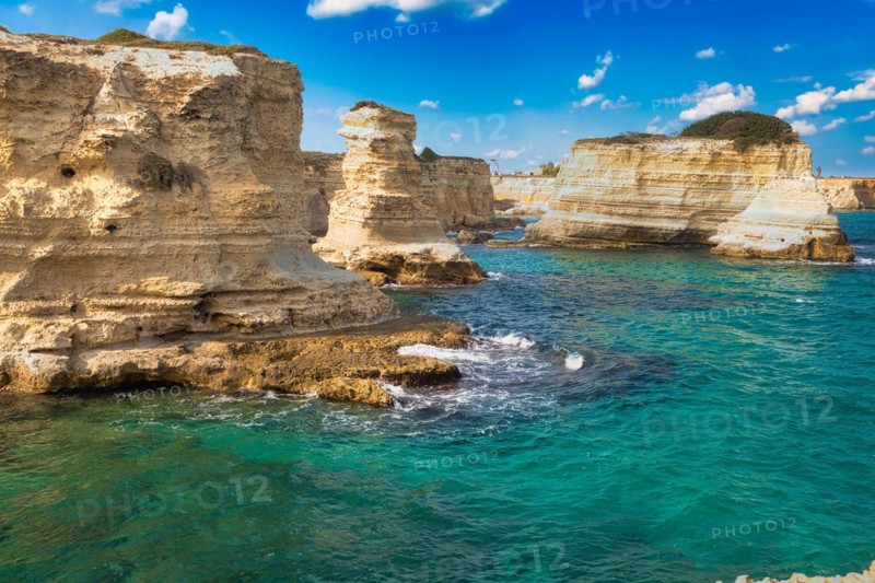 Rock stacks and crystal clear sea of the Faraglioni di Sant Andrea