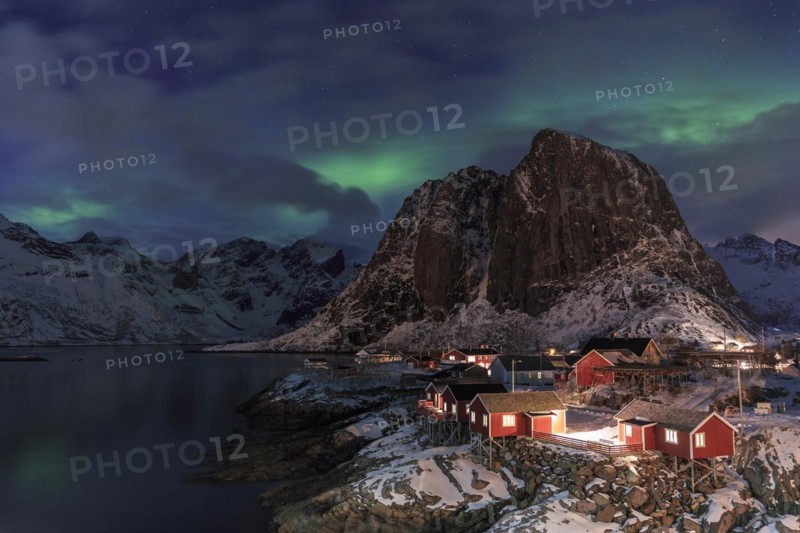 Northern Lights or Aurora Borealis over red rorbuer
